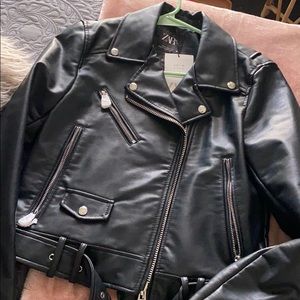 Leather jacket with belt and zipper detail